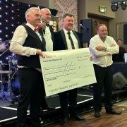 GNAAS delegates with their oversized cheque