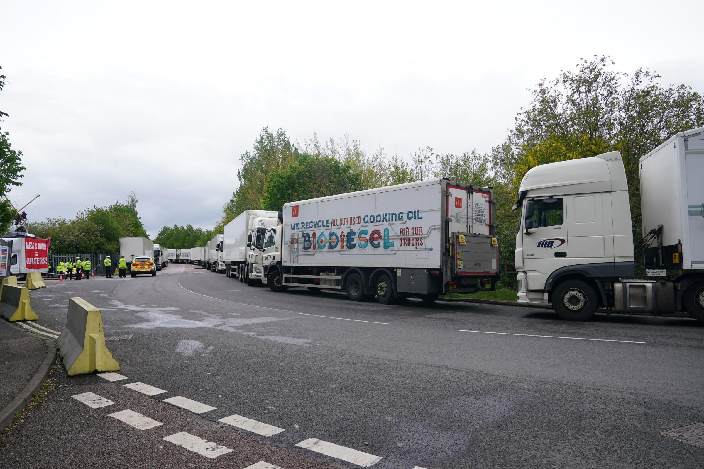 McDonalds trucks backed up outside a McDonalds distribution site in Hemel Hempstead, Hertfordshire, which is being blockaded by Animal Rebellion protesters to stop lorries from leaving the depot. Picture date: Saturday May 22, 2021. PA Photo. Animal
