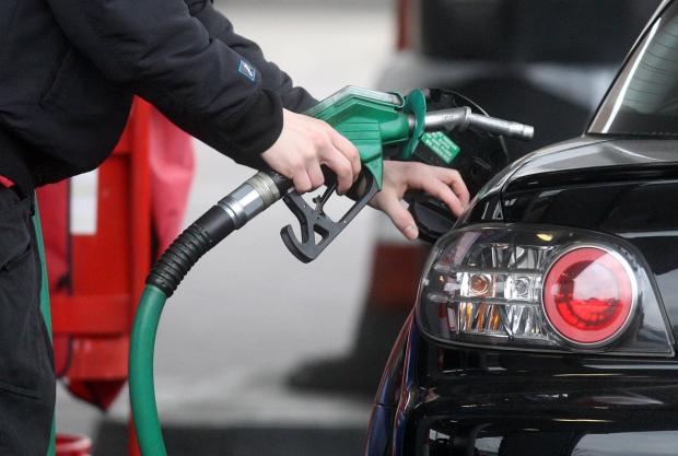Cumberland & Westmorland Gazette: Someone using a fuel pump at a petrol station (PA)