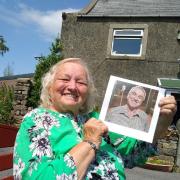 Issy Carr with a photo of her son, Keith, who she was forced to have adopted in 1955