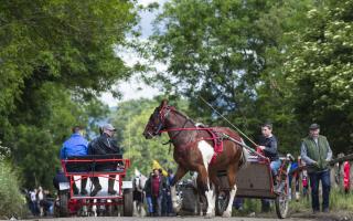 RESCHEDULED: People attend previous Appleby Horse Fair, an annual gathering of travellers, in Cumbria